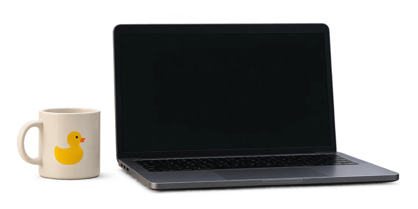 A laptop with an agent session on its screen, next to a mug with a yellow duck.